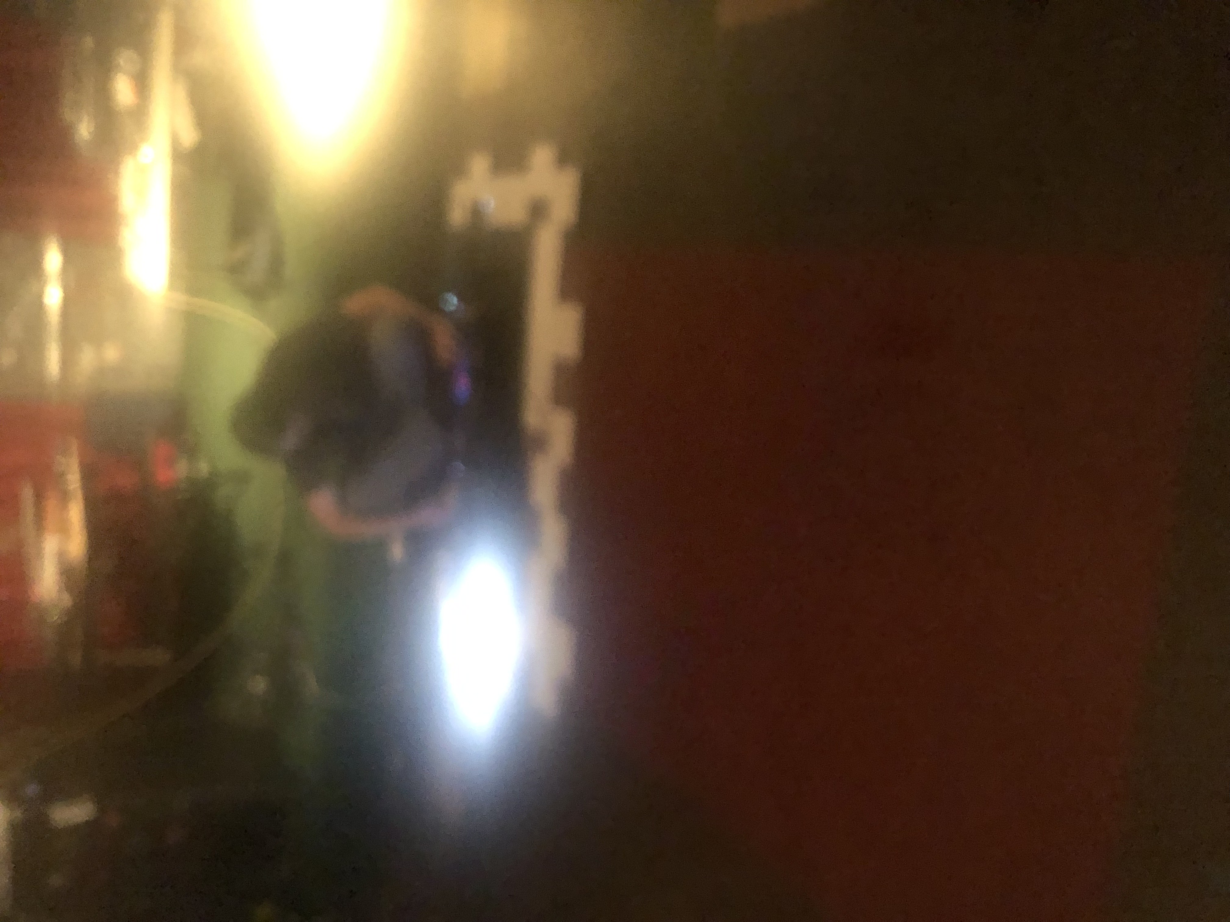 The Zero Collective at Le Voyeur in Olympia,Washington sitting in front of their many machines, many white square beyond those which are pulsating with the tunes they make in real time.